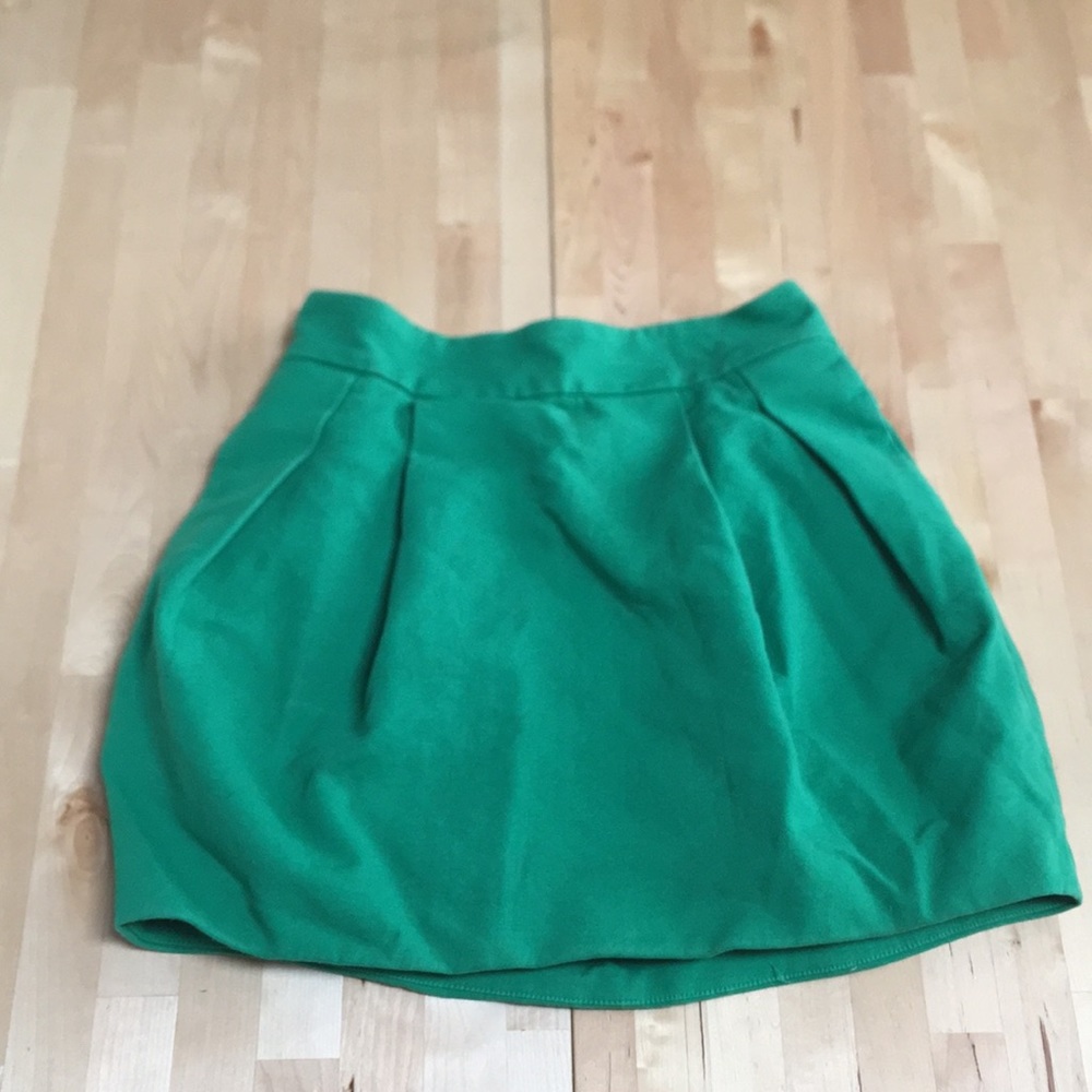 Woman’s green skirt